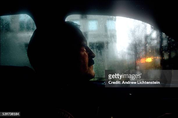 Police officer patrols in his squad car. In the mid-1990s, East Bridgeport became a neighborhood of heavy drug trafficking. Located right next to...
