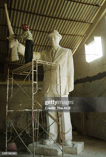 Statue of Saddam Hussein gets a wash at the foundry in Sheik Omar, Baghdad, 29 February 2003 THE AGE Picture by JASON SOUTH