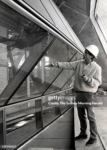 Architect Peter Hall explains the construction of the glass walls of the Sydney Opera House, which have been constructed on the site in 'mock-up', 6...