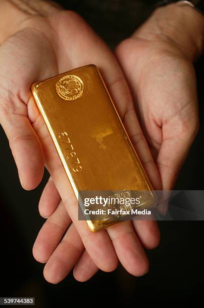 Perth Mint, 1 kg gold bar on female hands, 15 February 2006. AFR Picture by ERIN JONASSON