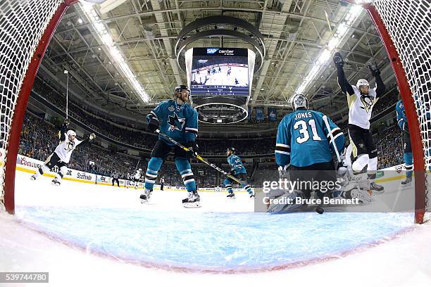 Martin Jones of the San Jose Sharks allows a goal to Brian Dumoulin of the Pittsburgh Penguins in the first period of Game Six of the 2016 NHL...
