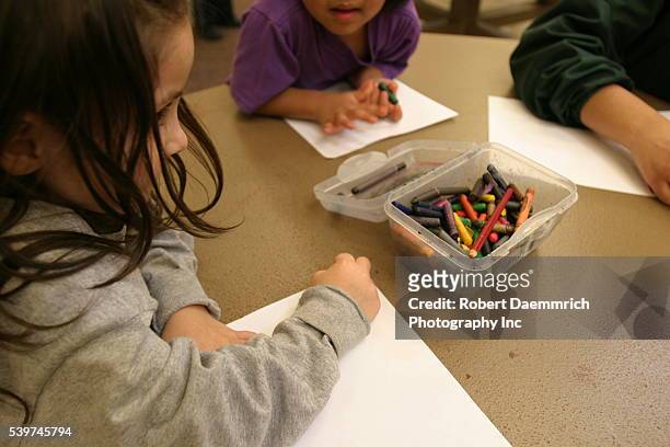 Children of alien families color at the T. Don Hutto Residential Center in Taylor, Texas. The center, an Immigration and Customs Enforcement...