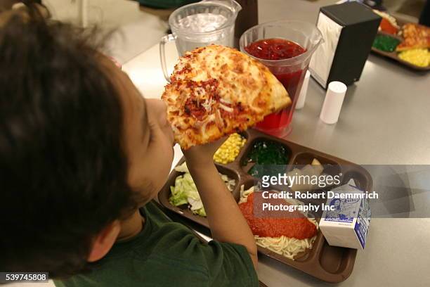 Children of alien families eat a meal at the T. Don Hutto Residential Center in Taylor, Texas. The center, an Immigration and Customs Enforcement...