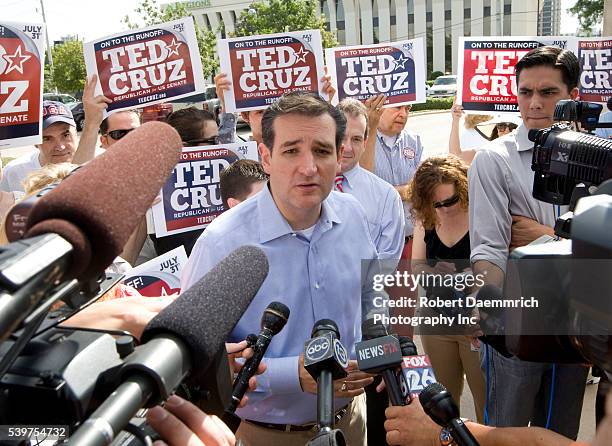 Tea Party favorite Ted Cruz of Houston talks to the press outside a Houston-area polling place prior to his upset victory of Texas Lt. Governor David...