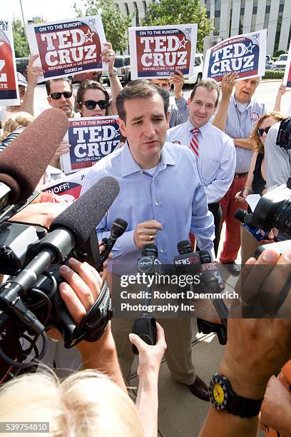 Tea Party favorite Ted Cruz of Houston talks to the press outside a Houston-area polling place prior to his upset victory of Texas Lt. Governor David...