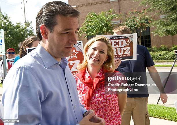 Tea Party favorite Ted Cruz, left, with his wife Heidi, of Houston talks to the press outside a Houston-area polling place prior to his upset victory...