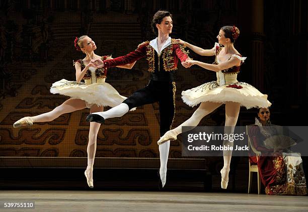 Anna Tikhomirova,Vladislav Lantratov and Anastasia Stashkevich with an artist of the company in the Bolshoi Ballet's production of Marius Petipa's...