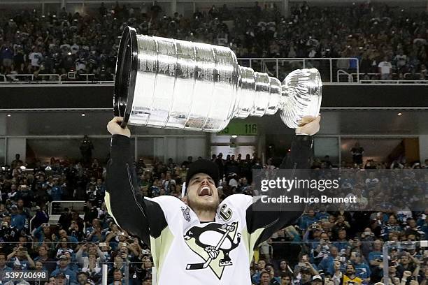 Sidney Crosby of the Pittsburgh Penguins celebrates with the Stanley Cup after their 3-1 victory to win the Stanley Cup against the San Jose Sharks...