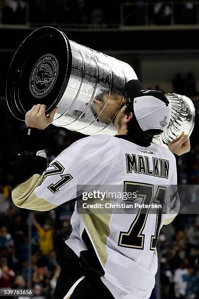 Evgeni Malkin of the Pittsburgh Penguins celebrates by kissing the Stanley Cup after their 3-1 victory to win the Stanley Cup against the San Jose...