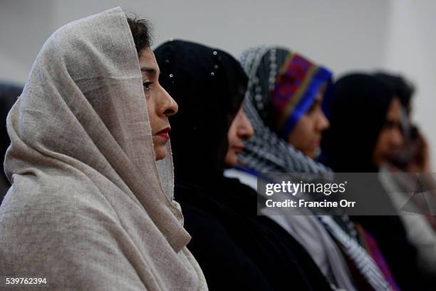 In the wake of this morning's shooting in Orlando, Farhat Naeem, left, attends an Ahmadiyya Muslim Community prayer vigil for the victims, at Baitul...