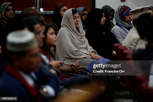 In the wake of this morning's shooting in Orlando, Farhat Naeem, center, attends an Ahmadiyya Muslim Community prayer vigil for the victims, at...