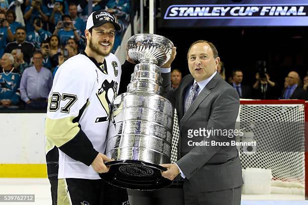 Sidney Crosby of the Pittsburgh Penguins recieves the Stanley Cup from NHL Commissioner Gary Bettman after their Game Six victory over the San Jose...