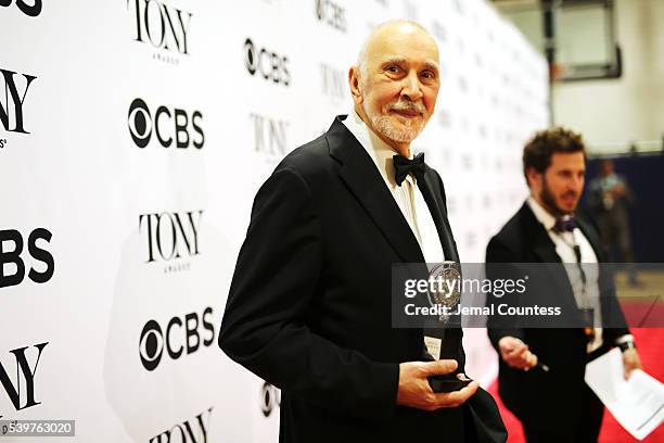 Actor Frank Langella poses in the press room with the award for Best Performance by an Actor in a Leading Role in a Play at the 70th Annual Tony...