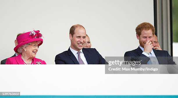 Queen Elizabeth II, Prince William, Duke of Cambridge and Prince Harry watch a carnival parade as they attend 'The Patron's Lunch' celebrations to...