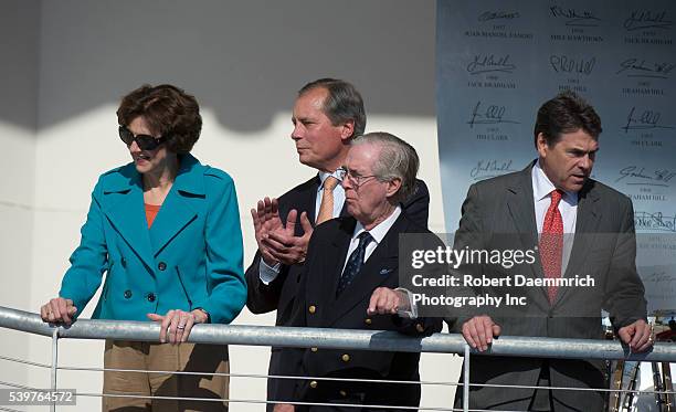 Texas state officials, left to right, Comptroller Susan Combs, Lt. Gov. David Dewhurst and Gov. Rick Perry with F1 official Nick Craw at the Circuit...