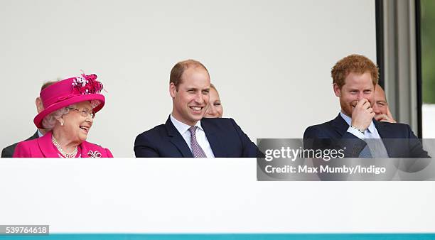 Queen Elizabeth II, Prince William, Duke of Cambridge and Prince Harry watch a carnival parade as they attend 'The Patron's Lunch' celebrations to...