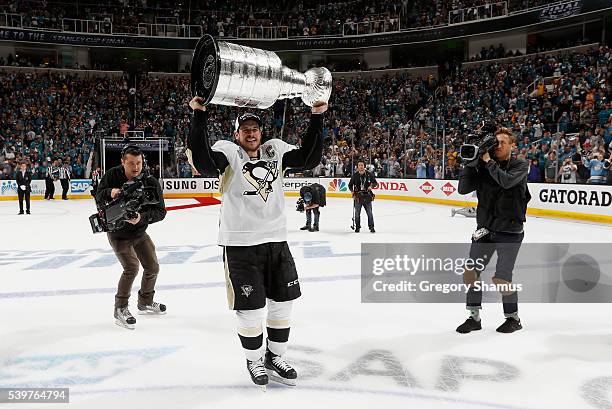 Sidney Crosby of the Pittsburgh Penguins lifts the Stanley Cup after his team won Game 6 of the 2016 NHL Stanley Cup Final over the San Jose Sharks...