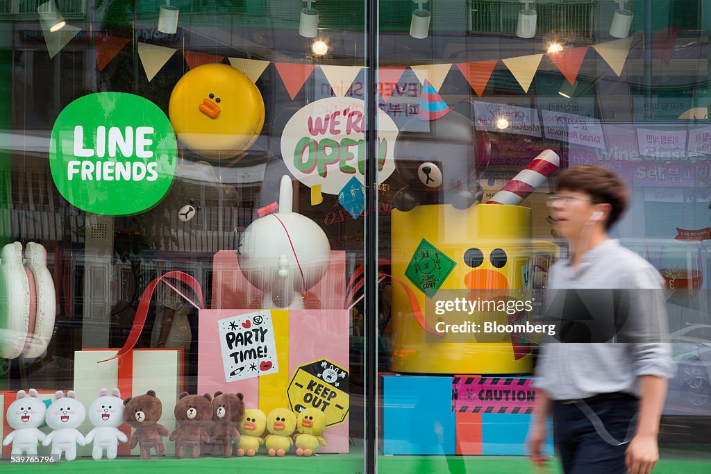 Line In A Store A pedestrian walks past a Line Friends flagship store, operated by ...