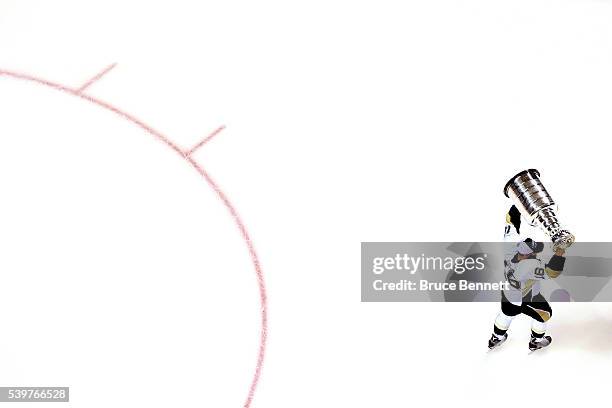 Eric Fehr of the Pittsburgh Penguins celebrates with the Stanley Cup after their 3-1 victory to win the Stanley Cup against the San Jose Sharks in...