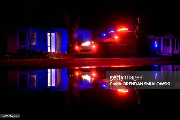 Sherif deputy guards a side street near the Pulse nightclub on June 12, 2016 in Orlando, Florida. People close to the gunman behind the attack on a...