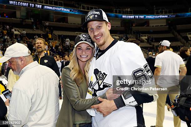 Steven Oleksy of the Pittsburgh Penguins celebrates with his girlfriend Meeghan Dunleavy after his teams 3-1 victory to win the Stanley Cup against...