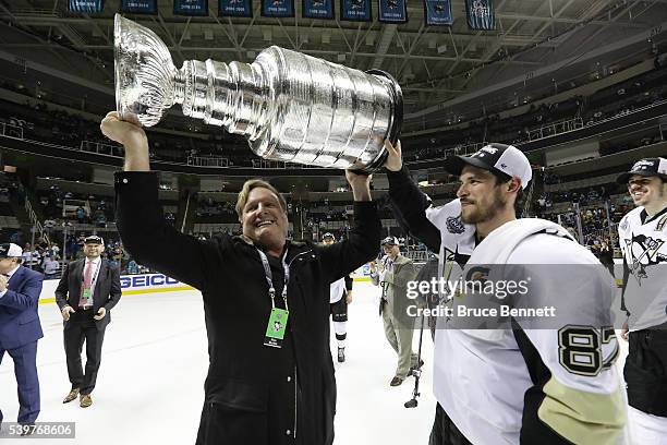 Pittsburgh Penguins owner Ron Burkle celebrates with Sidney Crosby after their 3-1 victory to win the Stanley Cup against the San Jose Sharks in Game...