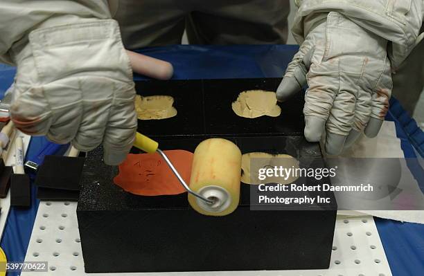 An epoxy-like fill material will be used to repair damaged tiles by astronauts in space. The two-part mixture will be dispensed into voids, curing in...