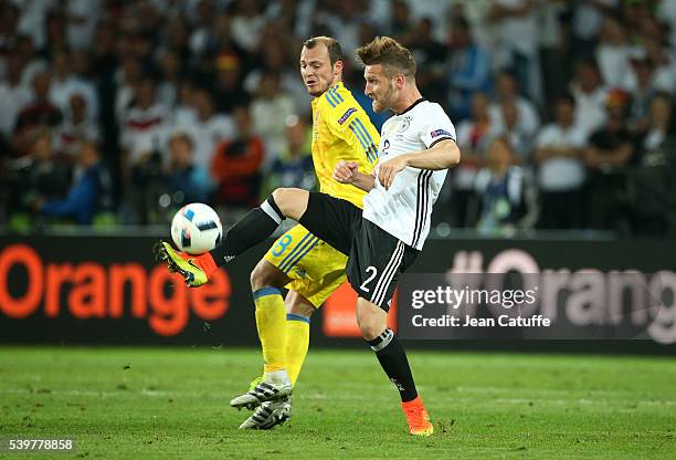 Shkodran Mustafi of Germany and Roman Zozulya of Ukraine in action during the UEFA Euro 2016 Group C match between Germany and Ukraine at Stade...