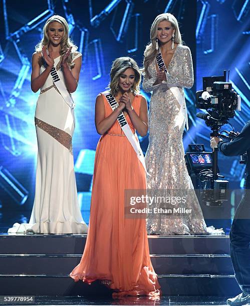 Miss Missouri USA 2016 Sydnee Stottlemyre and Miss Arkansas USA 2016 Abby Floyd look on as Miss California USA 2016 Nadia Mejia reacts after being...