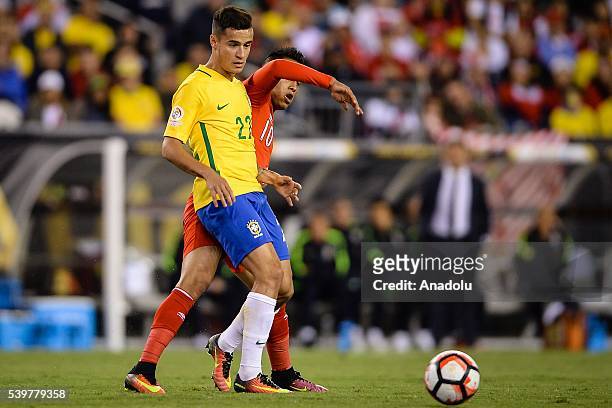 Christian Cueva of Peru struggle for the ball against Philippe Couthino of Brazil during the 2016 Copa America Centenario Group B match between...