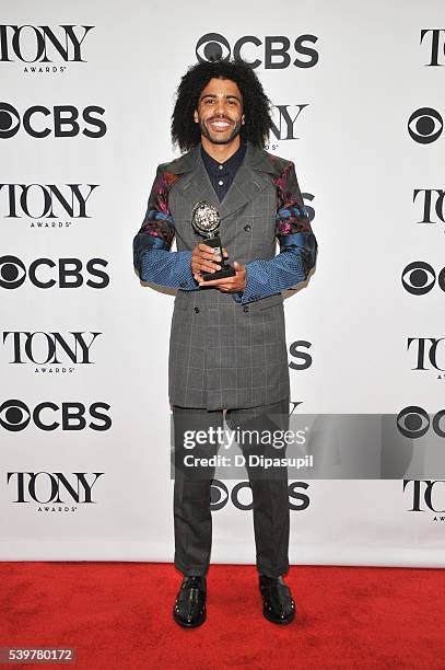 Daveed Digg poses in the press room with his award at the 70th Annual Tony Awards at the Beacon Theatre on June 12, 2016 in New York City.