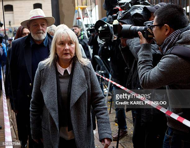 Reeva Steenkamp's father Barry and mother June arrive at the Pretoria High Court on June 13, 2016 for the sentencing hearing set to send South...