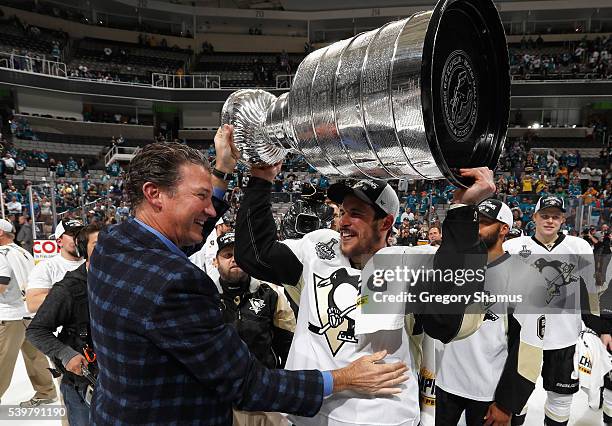 Sidney Crosby of the Pittsburgh Penguins and co-owner and chairman Mario Lemieux celebrate with the Stanley Cup after the Penguins won Game 6 of the...