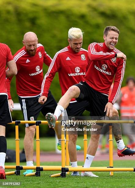 Wales player Chris Gunter shares a joke with Aaron Ramsey and James Collins during Wales training at their Euro 2016 base camp on June 13, 2016 in...