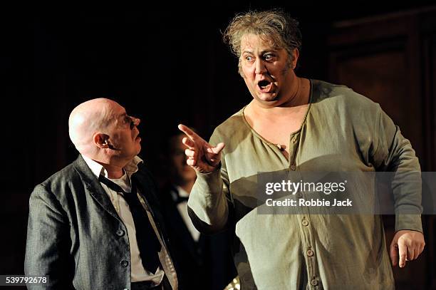 Ambrogio Maestri as Sir John Falstaff and Alasdair Elliott as Bardolfo in the Royal Opera's production of Giuseppe Verdi's Falstaff directed by...