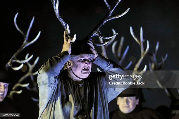 Ambrogio Maestri as Sir John Falstaff with artists of the company in the Royal Opera's production of Giuseppe Verdi's Falstaff directed by Robert...