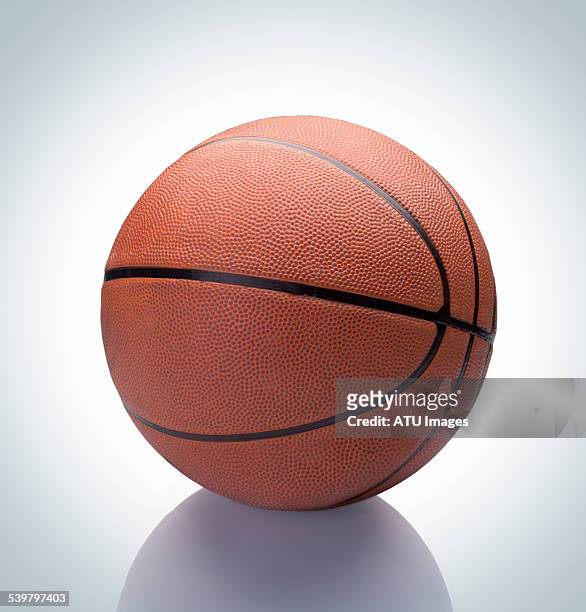 basketball on reflection - basketbal bal stockfoto's en -beelden