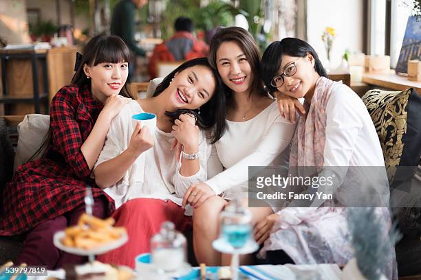 woman friends in cafe - chinese friends stock pictures, royalty-free photos & images