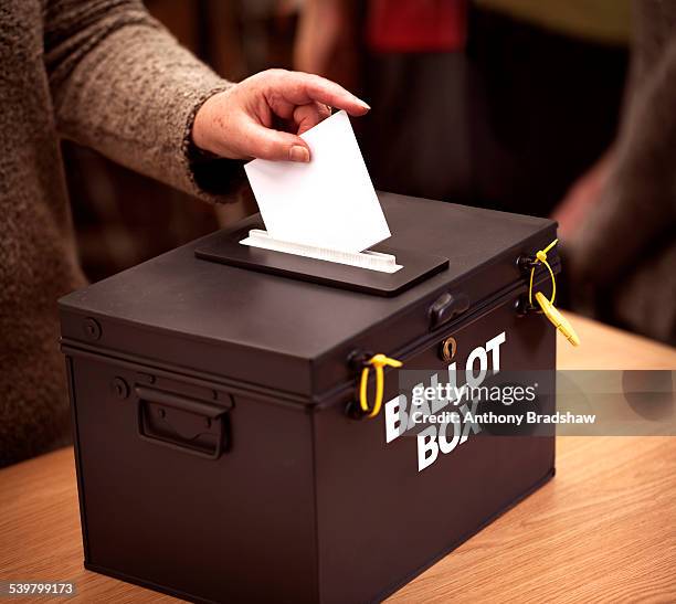 vote being cast at a polling station - democracy uk stock pictures, royalty-free photos & images