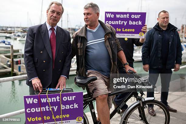 Leader Nigel Farage poses with a member of the public during a walk about on June 13, 2016 in Ramsgate, England. Mr Farage will be spending the day...