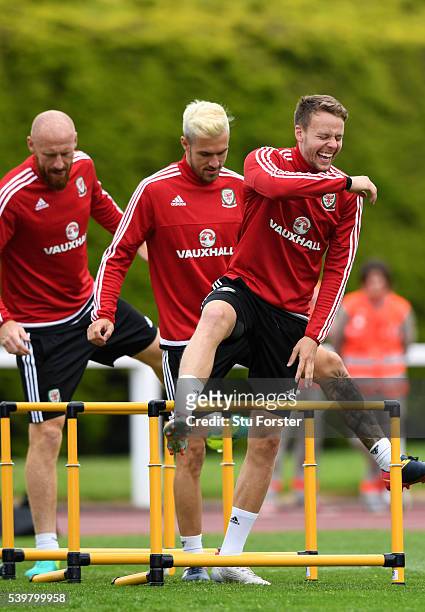 Wales player Chris Gunter shares a joke with Aaron Ramsey and James Collins during Wales training at their Euro 2016 base camp on June 13, 2016 in...