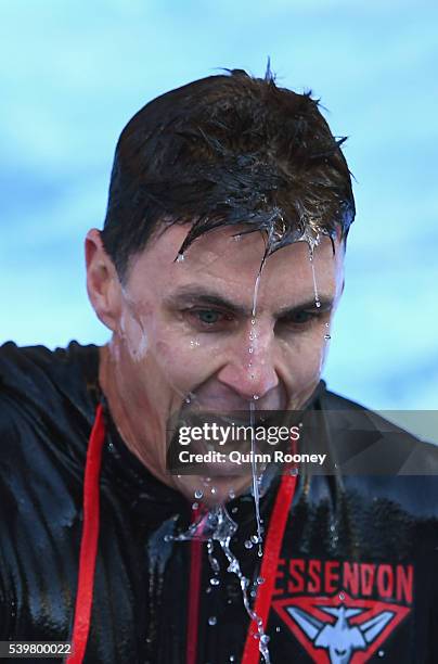 Matthew Lloyd goes down the slide and into the ice for Freeze MND during the round 12 AFL match between the Melbourne Demons and the Collingwood...