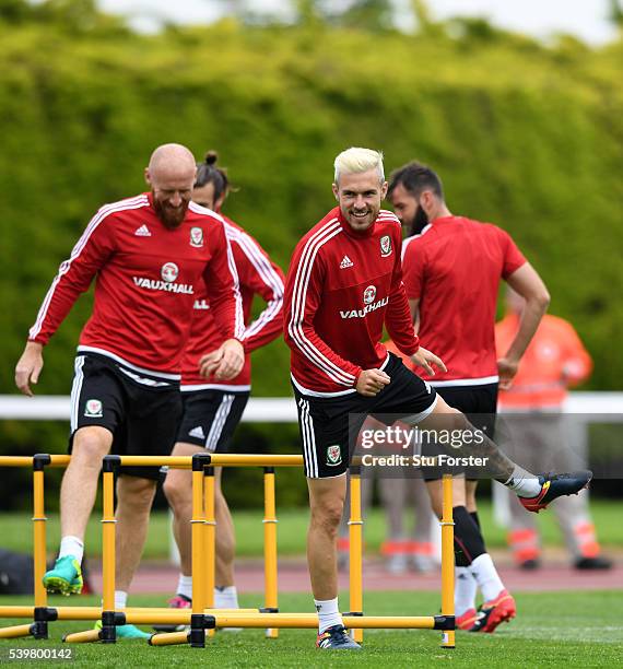 Wales player James Collins shares a joke with Aaron Ramsey during Wales training at their Euro 2016 base camp on June 13, 2016 in Dinard, France.