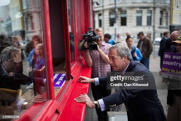 Leader Nigel Farage speaks with a member of the public during a walk about on June 13, 2016 in Ramsgate, England. Mr Farage will be spending the day...