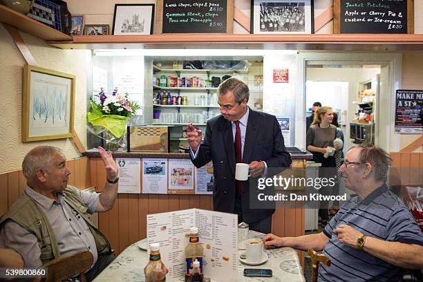 Leader Nigel Farage speaks to members of the public as the eat their breakfast in a cafe while having a walk about on June 13, 2016 in Ramsgate,...