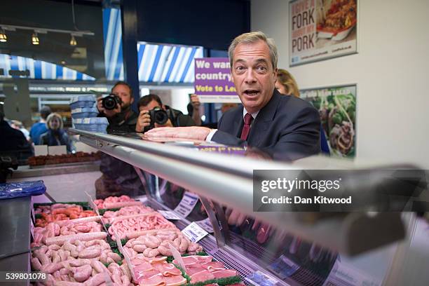 Leader Nigel Farage speaks to a butcher while having a walk about on June 13, 2016 in Ramsgate, England. Mr Farage will be spending the day driving...