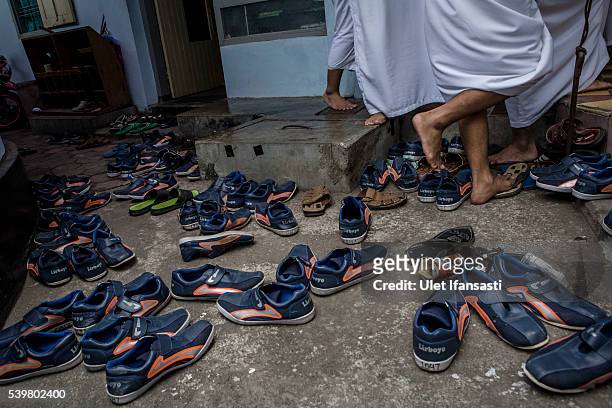 Students shoes are seen as they prepare to perform friday prayers at the islamic boarding school Lirboyo during the holy month of Ramadan on June 10,...