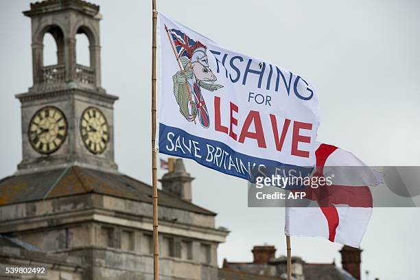 Pro-Brexit flag flies from a fishing boat moored in Ramsgate on June 13, 2016. Britain's opposition Labour Party today scrambled to make the case for...