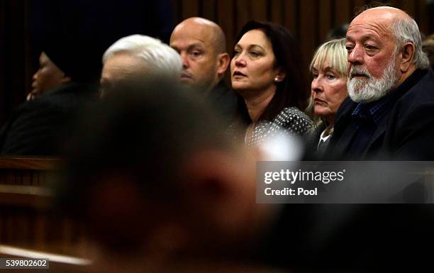 Reeva Steenkamp's father Barry Steenkamp with his wife June attend the sentencing hearing of Oscar Pistorius at North Gauteng High Court on June 13,...