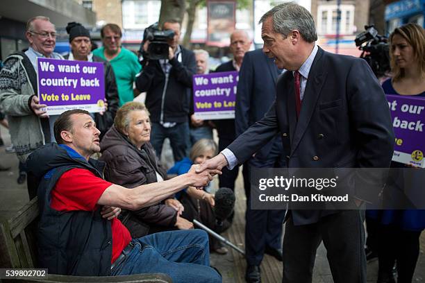Leader Nigel Farage speaks with a member of the public during a walk about on June 13, 2016 in Ramsgate, England. Mr Farage will be spending the day...